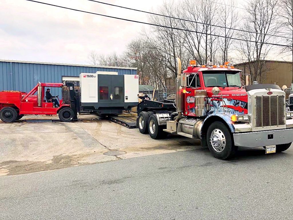 equipment being loaded onto trailer