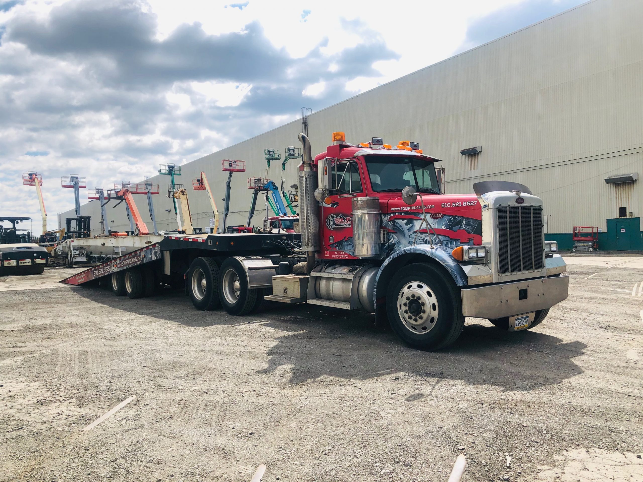 truck with equipment ramp trailer