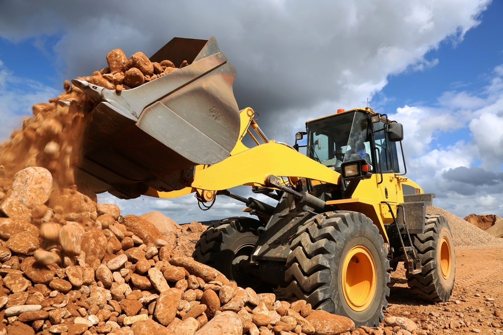 Front,End,Loader,Dumping,Stone,And,Sand,In,A,Mining